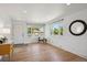 Spacious living room with hardwood floors, natural light, and a welcoming atmosphere at 1852 S Decatur St, Denver, CO 80219
