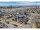 Aerial view of home showcasing proximity to lake, city and mountain views at 2053 Meade St, Denver, CO 80211