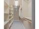 Walk-in closet with shelving and clothing rods providing ample storage space at 2053 Meade St, Denver, CO 80211