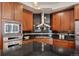 Well-equipped kitchen with stainless steel appliances and tile backsplash at 2053 Meade St, Denver, CO 80211