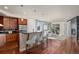 Eat-in kitchen island with barstool seating and hardwood floors at 2053 Meade St, Denver, CO 80211