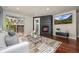 Bright living room with fireplace, backyard access and sleek modern finishes at 2053 Meade St, Denver, CO 80211