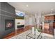 Inviting living room with fireplace, hardwood floors, and open floor plan at 2053 Meade St, Denver, CO 80211