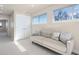 Bright living room featuring neutral tones, large windows, and a comfortable couch at 2053 Meade St, Denver, CO 80211