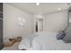 Spacious bedroom with modern gray accent wall, neutral carpet, and ambient recessed lighting at 2053 Meade St, Denver, CO 80211
