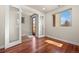 Versatile office space with hardwood floors, bright natural light, and a glass-paneled door at 2053 Meade St, Denver, CO 80211