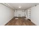 Unfinished basement featuring wood-look floors, fireplace, and built-in shelving at 1545 N Harrison St, Denver, CO 80206