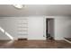 Unfinished basement featuring built-in shelving and an exterior exit at 1545 N Harrison St, Denver, CO 80206