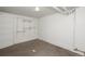 Basement bedroom with carpet, built-in shelving, and natural light at 1545 N Harrison St, Denver, CO 80206