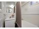 This bathroom features a bathtub, sink, and mirror at 1545 N Harrison St, Denver, CO 80206