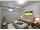 Cozy staged bedroom featuring modern decor, neutral color palette and natural light at 1545 N Harrison St, Denver, CO 80206