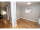 Neutral bedroom features hardwood floors and natural light through the window at 1545 N Harrison St, Denver, CO 80206