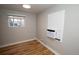 Charming bedroom with hardwood floors and window air conditioning at 1545 N Harrison St, Denver, CO 80206