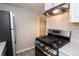 This home's kitchen features stainless steel appliances and modern finishes at 1545 N Harrison St, Denver, CO 80206