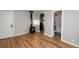 Living room featuring hardwood floors, modern decor, and a bathroom entry at 1545 N Harrison St, Denver, CO 80206