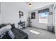 Guest bedroom with a black futon, work desk and ample light at 18315 E Amherst Dr, Aurora, CO 80013