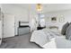Bright bedroom with a ceiling fan, a gray dresser, and a comfortable-looking bed at 18315 E Amherst Dr, Aurora, CO 80013