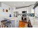 Modern kitchen featuring stainless steel appliances, a center island with seating, and updated countertops at 18315 E Amherst Dr, Aurora, CO 80013