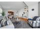 Spacious living room with hardwood floors, plush carpet, stylish furniture, and an open layout perfect for entertaining guests at 18315 E Amherst Dr, Aurora, CO 80013