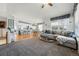 Open-concept layout seamlessly connects the living room, kitchen, and dining areas for easy entertaining at 18315 E Amherst Dr, Aurora, CO 80013