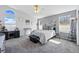 Serene main bedroom featuring vaulted ceilings, ample natural light, and a calming color scheme at 18315 E Amherst Dr, Aurora, CO 80013