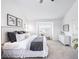 Bright bedroom offers neutral decor, plush carpet, and a large window for ample natural light at 18213 E Saskatoon Pl, Parker, CO 80134