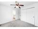 Bedroom featuring neutral carpet, closet with sliding doors, and an ensuite bathroom at 18213 E Saskatoon Pl, Parker, CO 80134