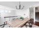 Upstairs dining area with wooden table and lots of natural light at 18213 E Saskatoon Pl, Parker, CO 80134