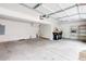 Spacious two-car garage with concrete flooring and ample storage space at 18213 E Saskatoon Pl, Parker, CO 80134