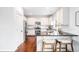 Well-lit kitchen featuring stainless steel appliances and a breakfast bar with seating at 18213 E Saskatoon Pl, Parker, CO 80134