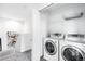 Laundry room with side-by-side washer and dryer and shelving at 18213 E Saskatoon Pl, Parker, CO 80134
