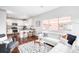 Open concept living space connecting a cozy living room to a modern kitchen at 18213 E Saskatoon Pl, Parker, CO 80134