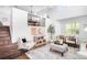 Bright living room features high ceilings, modern furnishings, and a staircase at 18213 E Saskatoon Pl, Parker, CO 80134