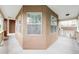 Outdoor hallway with beige walls, white railings, and natural light at 18213 E Saskatoon Pl, Parker, CO 80134