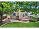 Home's backyard features wood deck, patio, and mature landscaping at 10249 Trailriders Dr, Littleton, CO 80125