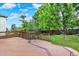 Lovely backyard features wooden deck with railing and green lawn at 10249 Trailriders Dr, Littleton, CO 80125