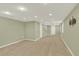Bright basement featuring neutral carpet, recessed lighting, and shelving at 10249 Trailriders Dr, Littleton, CO 80125