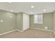 Finished basement features neutral carpet, recessed lighting, and closet space at 10249 Trailriders Dr, Littleton, CO 80125