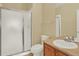 Bathroom featuring glass shower doors, a toilet, and a vanity at 10249 Trailriders Dr, Littleton, CO 80125