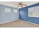 Upstairs bedroom featuring great natural light and neutral carpet at 10249 Trailriders Dr, Littleton, CO 80125