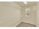 A spacious walk-in closet with built-in shelving and a window for natural light at 10249 Trailriders Dr, Littleton, CO 80125