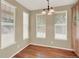 Well-lit dining room features wood floors, blinds, and wood cabinetry at 10249 Trailriders Dr, Littleton, CO 80125