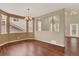 Spacious dining room with hardwood floors, lots of windows, and neutral wall color at 10249 Trailriders Dr, Littleton, CO 80125