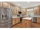 Modern kitchen featuring stainless steel appliances and a center island at 10249 Trailriders Dr, Littleton, CO 80125