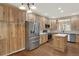 Beautiful kitchen with hardwood floors and stainless steel appliances at 10249 Trailriders Dr, Littleton, CO 80125