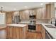 Modern kitchen featuring stainless steel appliances and a center island at 10249 Trailriders Dr, Littleton, CO 80125