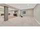 The basement rec room includes a wet bar, pool table area and neutral colored carpet at 15886 E Stargazer Ln, Parker, CO 80134