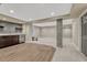 The basement area includes a wet bar, stone columns, and both carpet and hardwood flooring at 15886 E Stargazer Ln, Parker, CO 80134