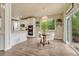 Dining area boasts a glass table, built-in oven, and a sliding glass door to the deck at 15886 E Stargazer Ln, Parker, CO 80134