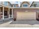 Attached garage and brick exterior of attractive home at 15886 E Stargazer Ln, Parker, CO 80134